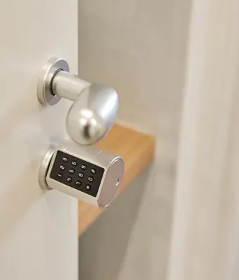an open door with a door knob with a key board at Station To Station Rome Ensuite Rooms in Rome