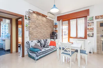 a living room with a couch and a table at LIVI20 Apartment Gemelli in Rome
