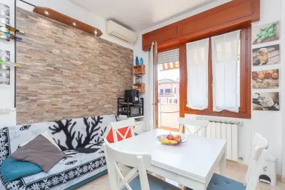 a living room with a white table and a couch at LIVI20 Apartment Gemelli in Rome