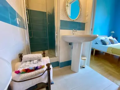 a bathroom with a sink and a toilet and a mirror at My Varrone Suite in Rome