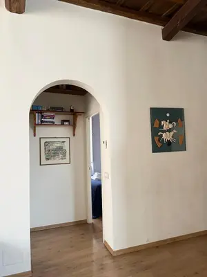 a hallway with an archway in a room at Artist apartment in the heart of Trastevere in Rome
