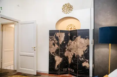 a map of the world on a wall in a room at Stella Luxury House - Lombardia in Rome