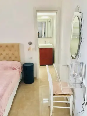 a bedroom with a glass table and a mirror at Piazza Navona in Rome