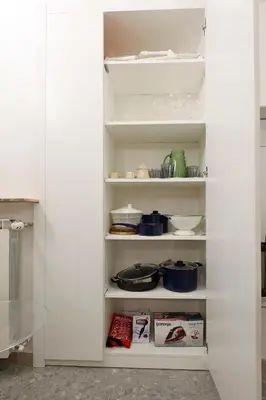 a white pantry filled with lots of dishes at Piazza Navona in Rome
