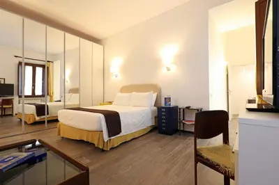 a hotel room with a bed and a mirror at Piazza Navona in Rome