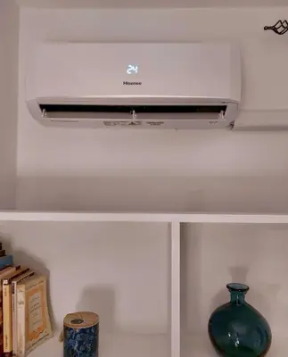 a white air conditioner sitting on top of a shelf at Sweet Home Acaia - San Giovanni in Rome