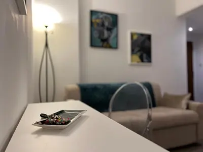 a bowl of fruit on a table in a living room at Sweet Home Acaia - San Giovanni in Rome