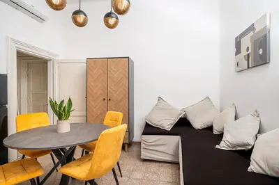 a living room with a table and a couch at Mazzini 38 in Rome