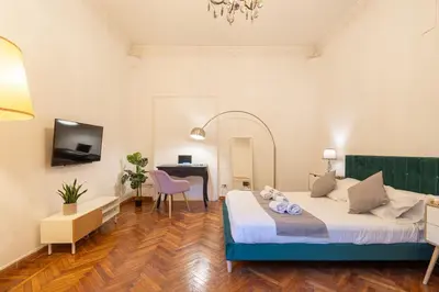 a hotel room with a bed and a desk at Mazzini 38 in Rome