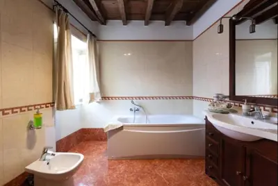 a large bathroom with a tub and a sink at Roman heritage- Pantheon- up to 6 guests in Rome