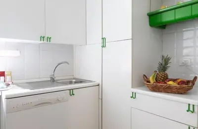 a kitchen with a basket of fruit and a sink at Roman heritage- Pantheon- up to 6 guests in Rome