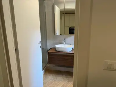 a bathroom with a sink and a mirror at Casal Sweet Home in Rome