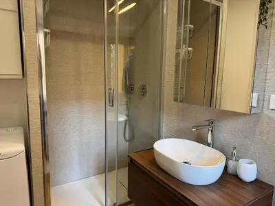 a bathroom with a sink and a shower at Casal Sweet Home in Rome