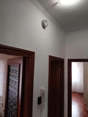 a room with two doors and a phone on the wall at Loft Tranquillo e Comodo, Vicino Metro e Vaticano in Rome