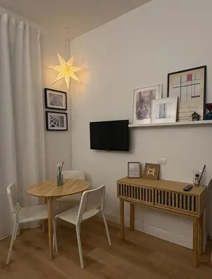 a dining room with a table and a table and a dining room table at Ilia12 home in Rome