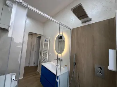 a bathroom with a sink and a glass shower at Trastevere ON in Rome