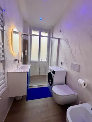 a bathroom with a toilet and a sink and a shower at Trastevere ON in Rome