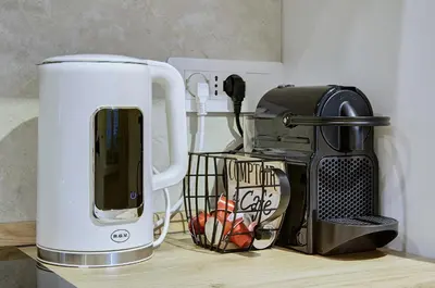 a kitchen counter with a coffee maker and a toaster at Silver Loft San Giovanni in Rome
