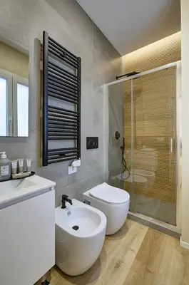 a bathroom with a sink and a toilet and a shower at Silver Loft San Giovanni in Rome