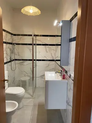 a bathroom with a toilet and a sink at Rachel house in Rome