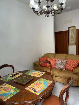 a living room with a table and a couch at Rachel house in Rome