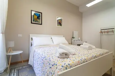 a bedroom with a bed with towels on it at Studio Piramide in Rome