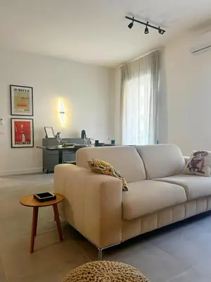 a living room with a couch and a table at CASA FRANCISCA - New Boutique Apartment in Rome
