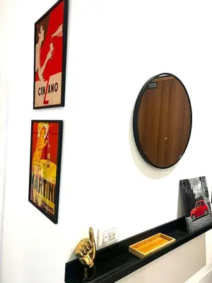 a shelf with a mirror and a toy car on it at CASA FRANCISCA - New Boutique Apartment in Rome