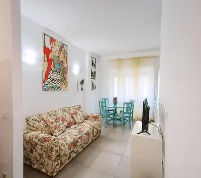 a living room with a couch and a table at A Casa di Adriana in Rome