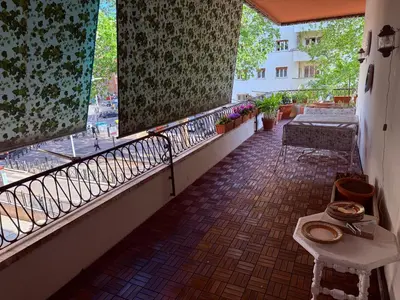 a balcony with a table and a bench on it at Luxury Home Museum - Roma - RAI - Stadio Olimpico - Vaticano - Musei Vaticani - Centro - Clodio in Rome
