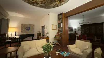 a living room with two white couches and a piano at Luxury Home Museum - Roma - RAI - Stadio Olimpico - Vaticano - Musei Vaticani - Centro - Clodio in Rome
