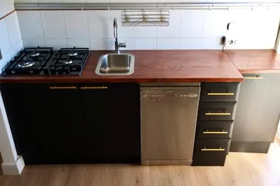a kitchen with a sink and a stove at Caesar's Nest in Rome