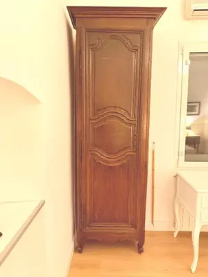 a wooden door in the corner of a room at Caesar's Nest in Rome