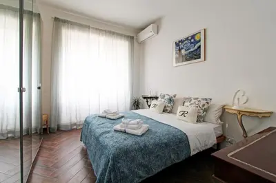 a bedroom with a bed with two towels on it at A casa di Chloe - Ponte Milvio in Rome