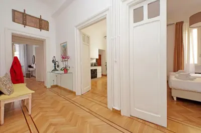 a living room with a door leading to a bedroom at TreasureRome Adriana Charme 4BR in Rome