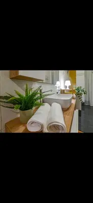a bathroom with a sink and towels on a counter at Mamma ROMA ART in Rome