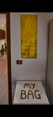 a sign that says my bag in front of a painting at Mamma ROMA ART in Rome