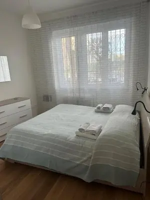 a bedroom with a bed with two towels on it at Charlie Apartment 1C in Rome