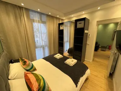 a bedroom with a large bed with towels on it at Vaticano Appartamento Suite Roma Centro Aura D2 in Rome