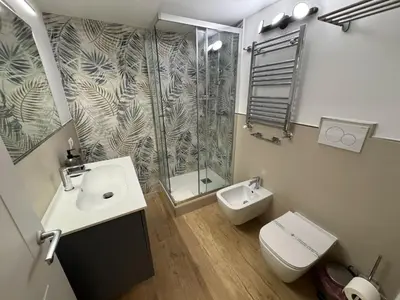 a bathroom with a shower and a toilet and a sink at Vaticano Appartamento Suite Roma Centro Aura D2 in Rome
