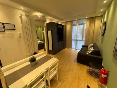 a living room with a couch and a television at Vaticano Appartamento Suite Roma Centro Aura D2 in Rome