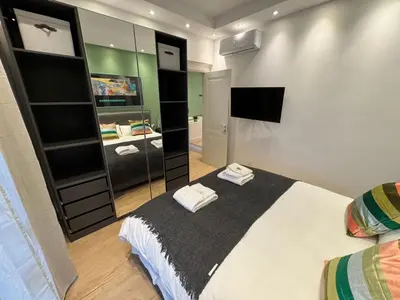 a bedroom with a large bed and a mirror at Vaticano Appartamento Suite Roma Centro Aura D2 in Rome