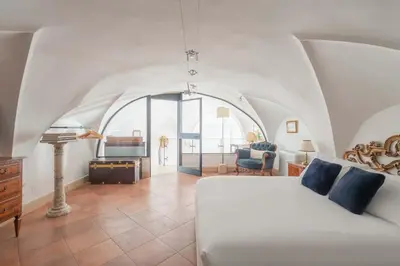 a white bathroom with a shower and a sink at Beatrix Apartment in Trastevere by Nosdom Properties in Rome