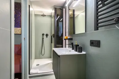 a bathroom with a sink and a shower at Casina Doria Pamphili in Rome