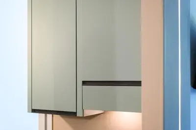 a white cabinet with a mirror next to a window at Casina Doria Pamphili in Rome