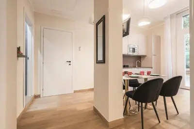 a kitchen and dining room with a table and chairs at Appartamento fino a 17 persone in centro a 17 minuti a piedi da Piazza di Spagna in Rome