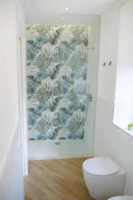 a bathroom with a shower with a white toilet at Rome Urban Retreat - Metro A in Rome