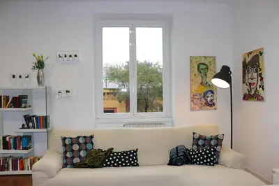 a living room with a couch with pillows on it at Saint Bon Dream in Rome