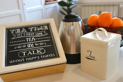 a chalk board next to a sign and a basket of oranges at Saint Bon Dream in Rome