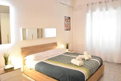 a living room with a bed and a tv at Banksy house in Rome intero appartamento in Rome